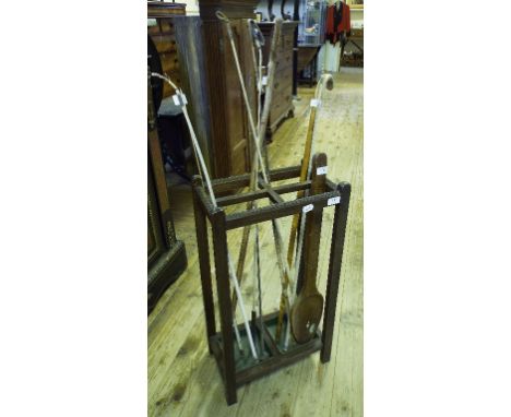 An oak stick stand, coaching whips and other items
