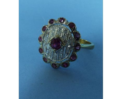 A 9ct gold, ruby and diamond oval panel ring