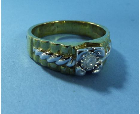 A 9ct gold and single diamond band ring