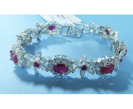 A silver and ruby bracelet