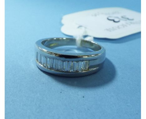 An 18ct gold and baguette cut diamond band ring