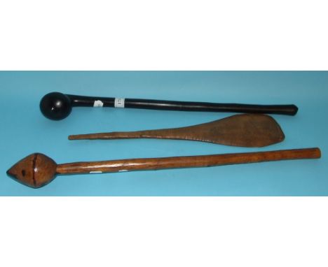 An ethnic hardwood throwing knobkerrie, a tribal pointing stick, and a paddle (3)