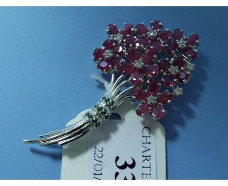 A silver and ruby floral spray brooch