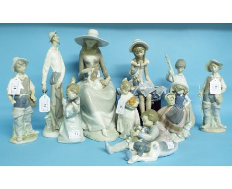 A Lladro figure, of a seated girl with a dog, 30.5 cm high, and nine similar figures (10)