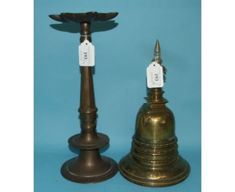 An Eastern brass stupa, 25.5 cm high, and an Islamic lamp, signed, 31 cm high (2)