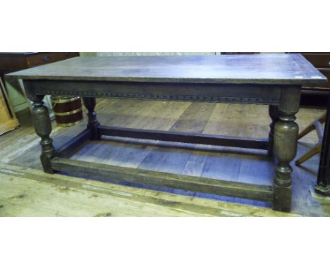 A 17th century style oak refectory table, on turned legs joined by stretchers, 183 cm wide Condition report Report by GH

Sev