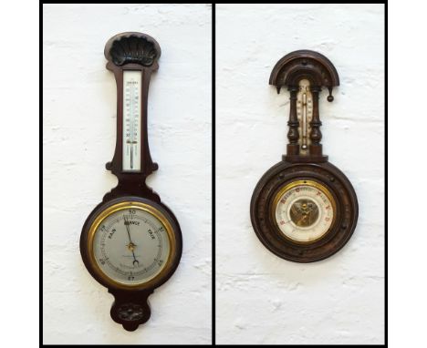 'REYNOLDS AND BRANSON LTD OF LEEDS' BAROMETERin a mahogany case surmounted with a shell above a silvered thermometer with a s