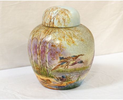 LARGE CARLTON WARE GINGER JARdecorated with duck and ducklings in a woodland setting, signed M. L. Walker in two places, 26cm