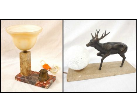 FRENCH ART DECO STYLE TABLE LAMPmodelled with a spelter stag and spherical glass shade, raised on a rectangular marbled base,
