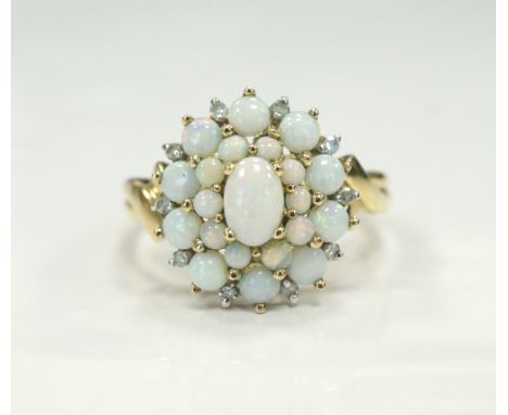 ATTRACTIVE OPAL CLUSTER RINGon nine carat gold shank, ring size Q