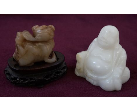 CARVED JADE FIGUREof a stylised cat, on associated wooden stand, 4.5cm high including stand; together with a white hardstone 