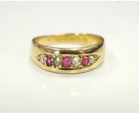 GRADUATED RUBY AND DIAMOND SEVEN STONE RINGon eighteen carat gold shank, ring size K
