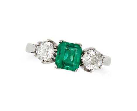 AN EMERALD AND DIAMOND THREE STONE RING in platinum, set with an octagonal step cut emerald of 1.01 carats between two old cu