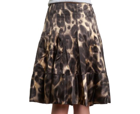 PRADA SILK PRINTED PLEATED SKIRTCondition grade B+.Size Italian 44. 80cm waist, 65cm length. Black and beige toned printed si
