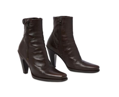 PRADA BROWN HEELED ANKLE BOOTSCondition grade B-.Size 35.5. Heel height 10cm. Brown toned leather boots with side zip opening