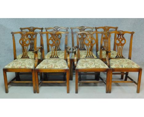 A set of eight 20th century Chippendale style oak dining chairs with pierced splat back and drop in seats, to include two car