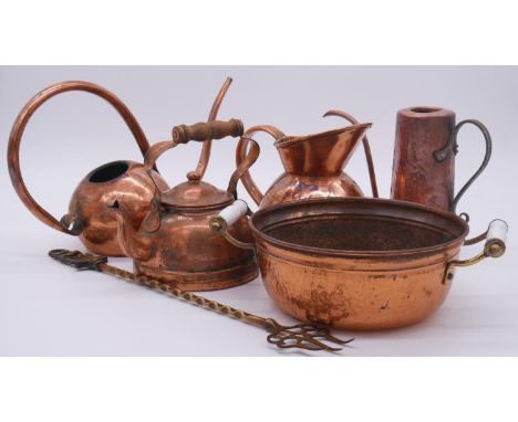 A collection of copper and brass. Including a brass Warwick bear toasting fork, a De Klerk South African copper water jug and