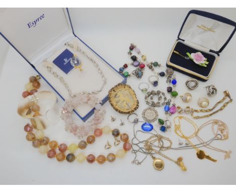 A Swarovski globe ornament, a carved horn brooch, rose quartz bracelet and other items of costume jewellery Condition Report: