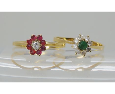 A 14k gold ruby and diamond flower ring size N, together with a similar emerald and diamond example size n, weight together 2