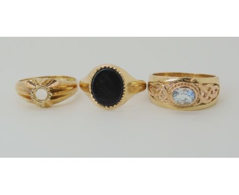 A 9ct Clogau gold gents aquamarine ring size U, a 9ct onyx signet ring and star ring shank lacking stone, weight combined 12g