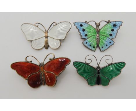 Four silver and enamel butterfly brooches two by David Andersen, one by Holth and one unnamed Condition Report: Not available