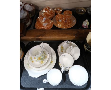 A lot comprising a Royal Albert part tea service decorated with daffodils and an Anchor Hoking peach lustre part tea service 