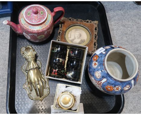 A lot comprising a set of Japanese black lacquered napkin rings, an ornately carved wooden photo frame, a pink ground Chinese
