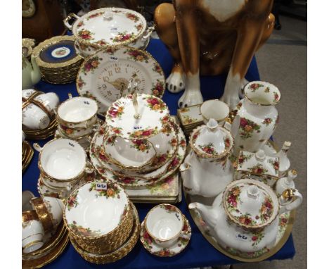 A Royal Albert Old Country Roses dinner service, comprising tea and coffee pot, cake plate, dinner plates, tureen, bowls and 