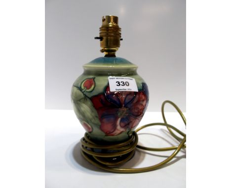 A Moorcroft Anemone pattern table lamp, 22cm high Condition Report: Available upon request