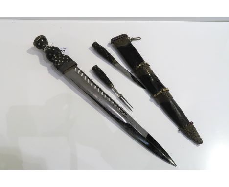 A piper's dirk with cairngorm set pommel &amp; subsidiary Knife &amp; fork 50 cm o/all length Condition Report: Available upo