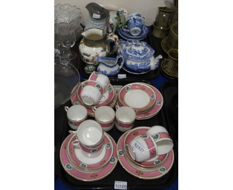 A lot comprising a pink ground gilt and floral decorated tea cups and saucers, manufacturers signature JB and bell symbol, Sp
