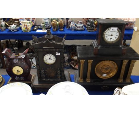 A black slate mantle clock and three other clocks Condition Report: Available upon request
