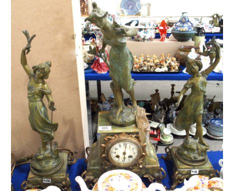 A French onyx and green patinated spelter mantle clock and garniture Condition Report: Available upon request