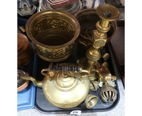 A selection of brassware including a pot with repousse floral decoration and another example, a kettle, candlestick, bells, t