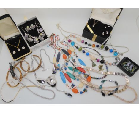 An Atelier Swarovski necklace designed by Jean Paul Gaultier, a bangle by Fossil and other items Condition Report: Not availa