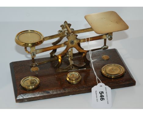A set of vintage postal scales with associated weights Condition Report: Available upon request
