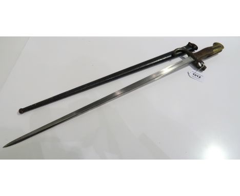 A French sword bayonet in scabbard, the blade inscribed St. Etienne 1877 Condition Report: Available upon request