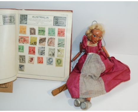 A stamp album, loose stamps and Pelham Puppet Condition Report: Available upon request