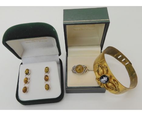 Silver and amber ring and earrings together with a vintage costume bangle Condition Report: Not available for this lot
