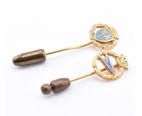Two hallmarked 9ct gold BOAC stick pins. The lot to include a hallmarked 9ct gold and blue enamel British Overseas Airways Co