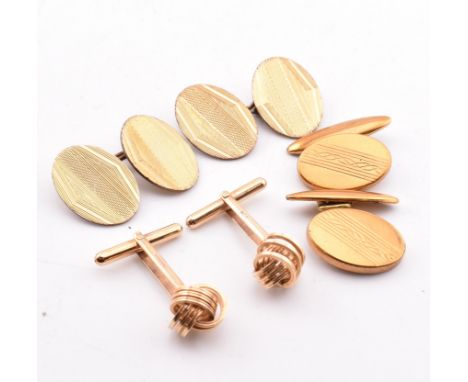 Three pairs of cufflinks. The lot to include a pair of hallmarked 9ct yellow gold knot design cufflinks with bullet backs, ha