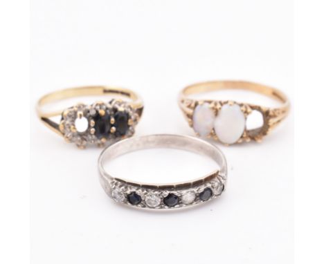Two hallmarked 9ct gold and gem set rings AF and a 9ct gold on silver ring. The lot to include a hallmarked 9ct gold and oval
