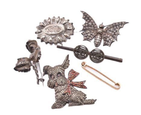 A collection of brooch pins including silver and metal. The lot to include a 12ct front, back and sides brooch pin with metal