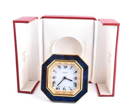 Cartier Les Must de Cartier Paris simulated lapis lazuli travel clock. The clock with manual-wind movement, octagonal white e