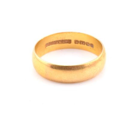 A hallmarked 22ct gold band ring. The 22ct yellow gold band ring hallmarked for Birmingham, 1968. Maker's mark J.C.M&amp;S Lt