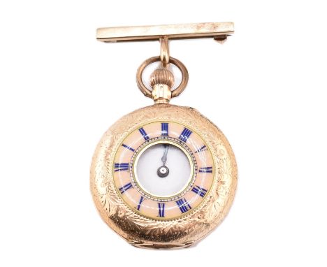 An early 20th century 14ct gold half hunter fob watch. The watch with a foliate engraved outer case with a pink iridescent an