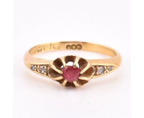 An Edwardian hallmarked 18ct gold paste and diamond ring. The ring set with a claw mounted red paste stone having diamond acc