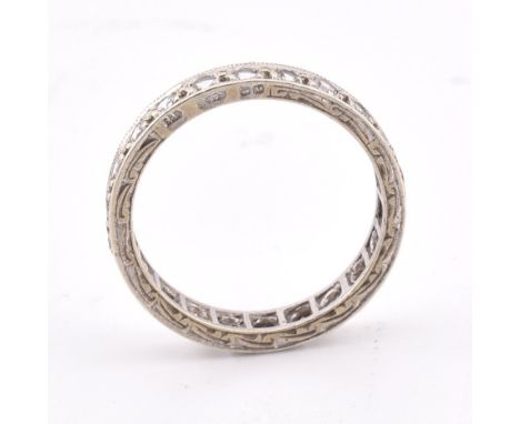 A hallmarked 9ct white gold eternity ring. The 9ct white gold eternity ring set all around with round cut spinel to decorativ
