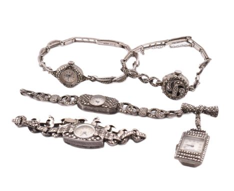 Five silver and marcasite watches. The watches to include three silver and marcasite wristwatches, two hallmarked and the oth