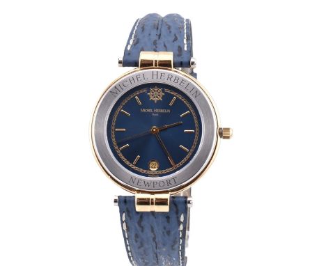 A Michel Herbelin Paris Newport wristwatch. The watch in the original case with manual.Model Specifications 142456/T35:This m